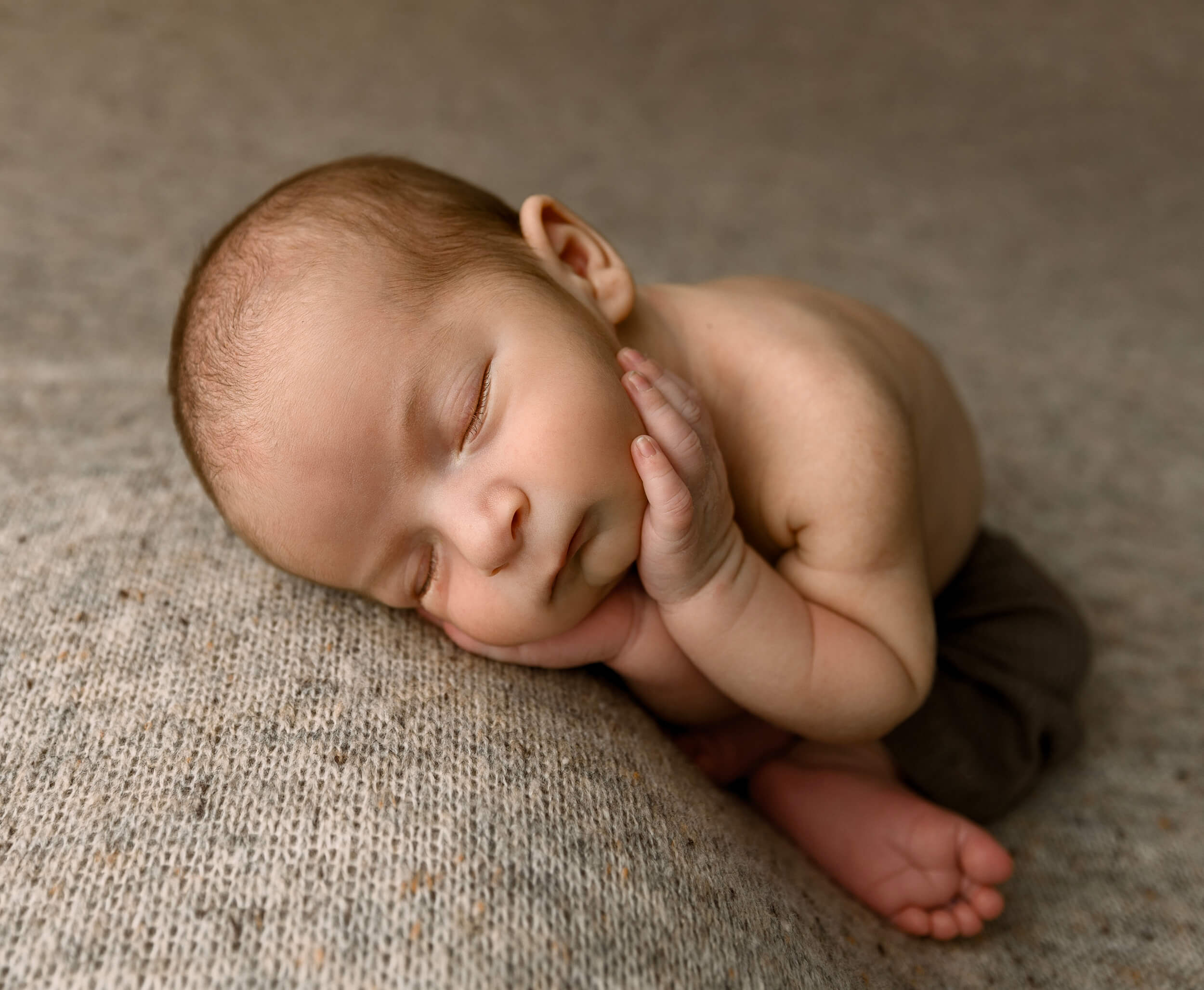 Photo of a baby in a fallen froggie pose